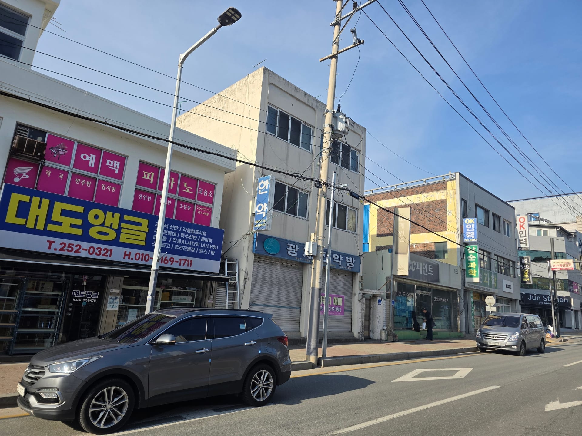 3-story commercial and residential building on a main road — image 3